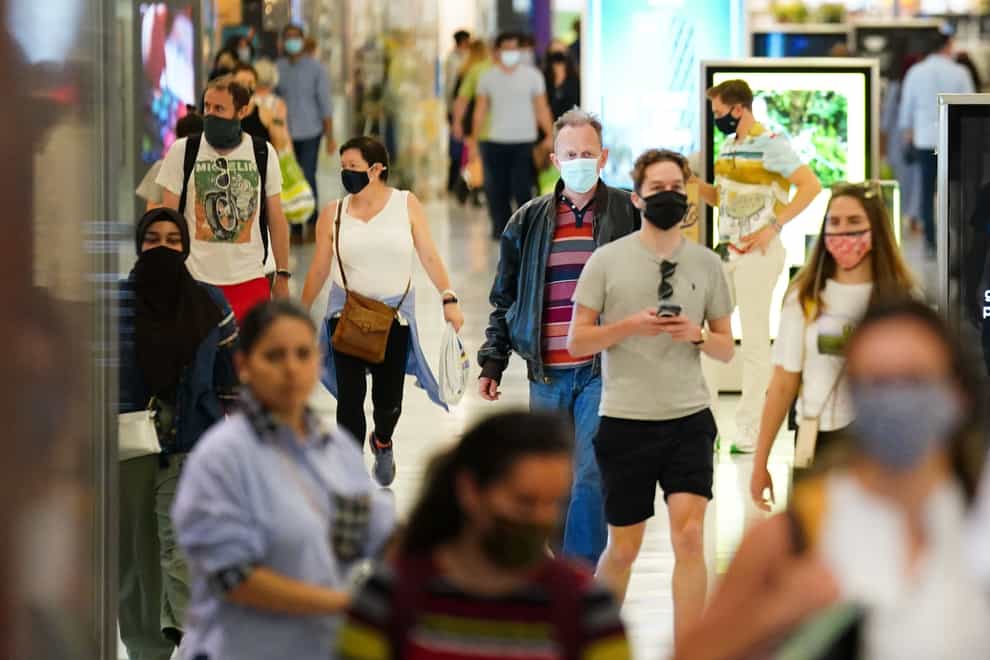 Shoppers wearing facemasks inside a shopping centre in East London (Victoria Jones/PA)