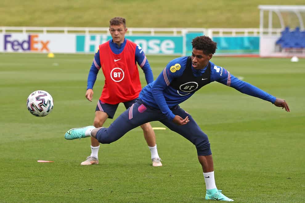 Marcus Rashford stretches for the ball in training