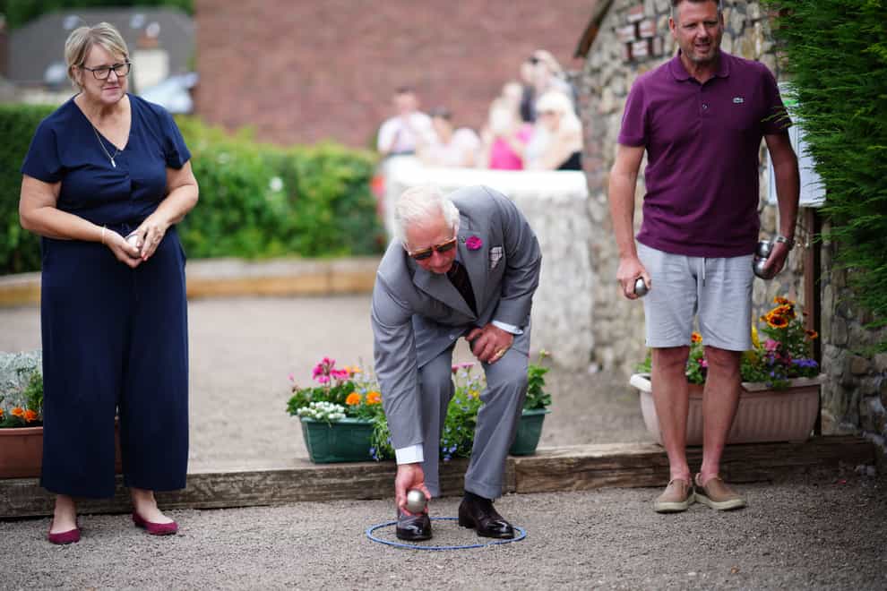 The Prince of Wales tries his hand at petanque (boules) (Ben Birchall/PA)