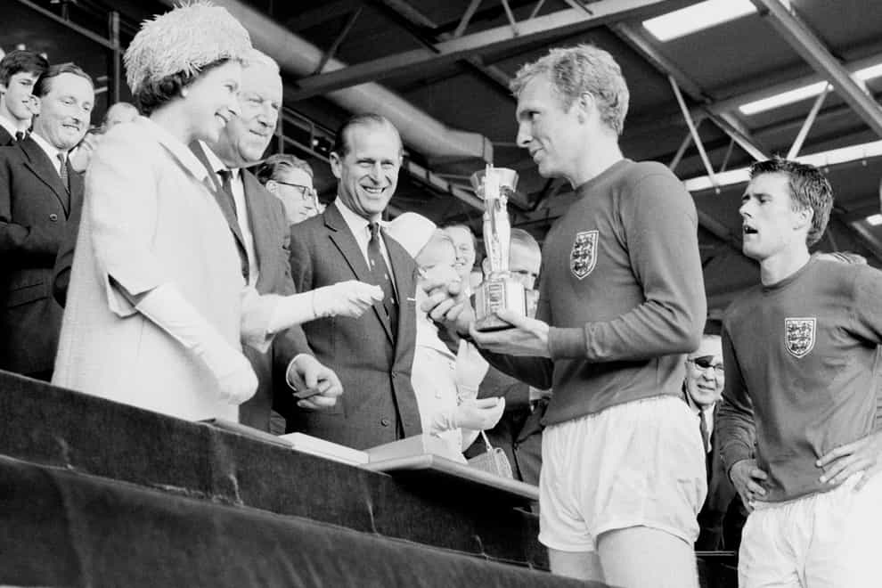 <p>The Queen presents Bobby Moore with the World Cup in 1966</p>
