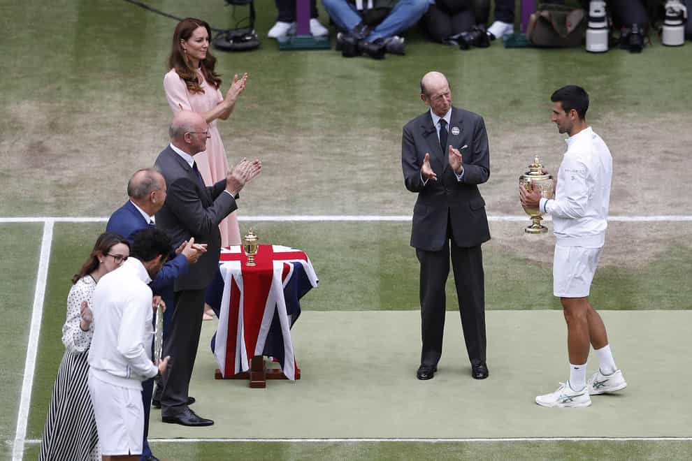 Novak Djokovic receives the trophy from the Duke of Kent after winning the men's singles final at Wimbledon (Peter Nicholls/PA)