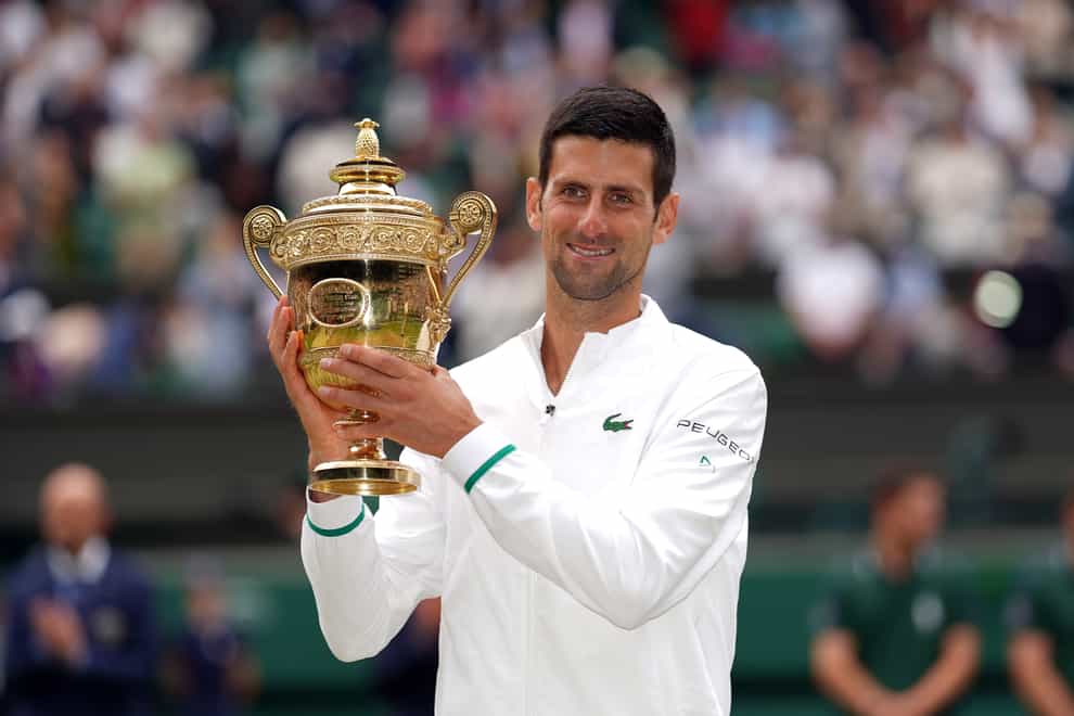 Novak Djokovic holds the Wimbledon trophy again