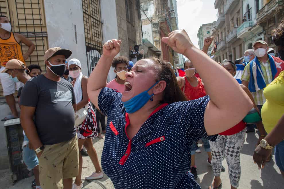 A woman shouts during an anti-government protest in Havana, Cuba