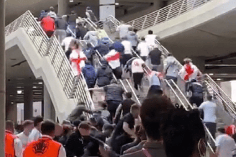 England fans run up the stairs after breaking past security at Wembley