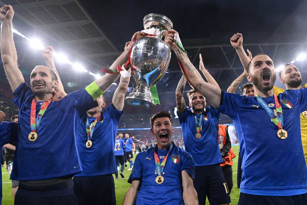 Italy’s Giorgio Chiellini and Leonardo Bonucci celebrate with the European Championship trophy