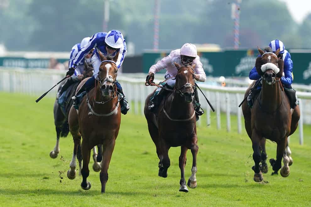 Josh Bryan drives home Johnny Drama (left) to a narrow victory in the John Smith’s Cup at York