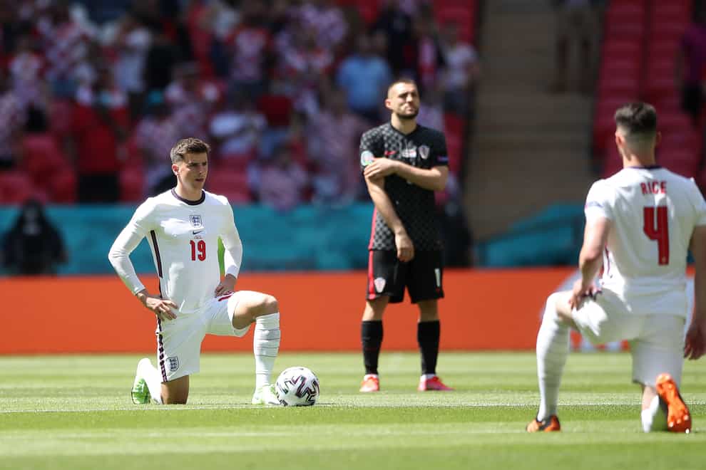 England’s Mason Mount (left) and Declan Rice take the knee before a Euro 2020 group match at Wembley