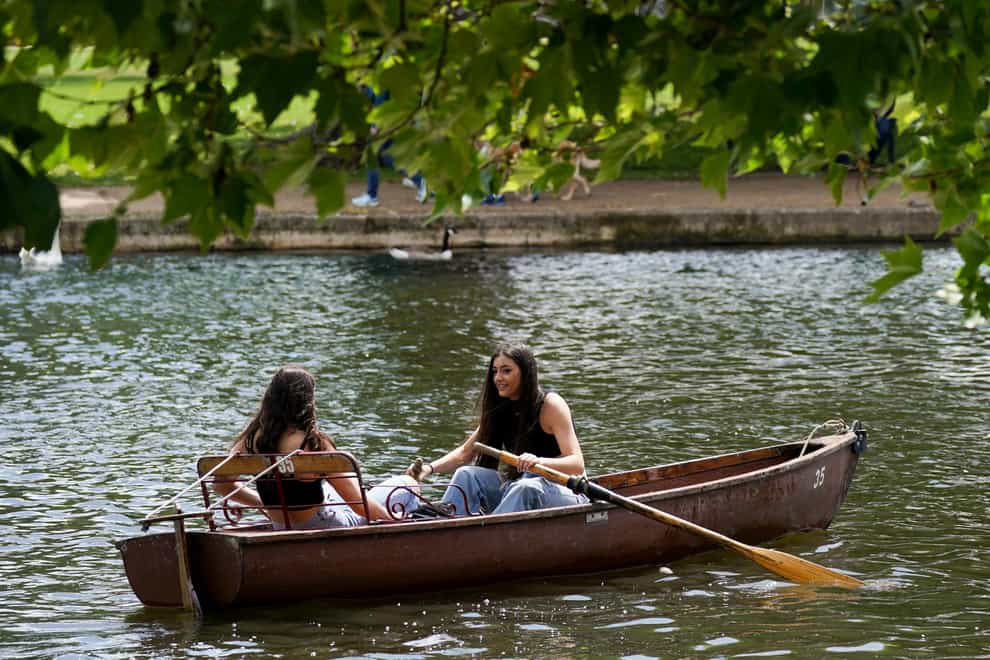 <p>Friends row along the River Avon</p>