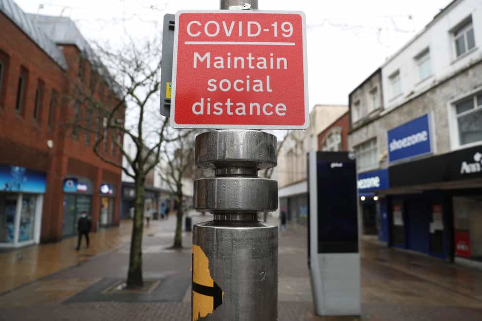 <p>A Covid-19 social distancing sign on Commercial road in Portsmouth</p>