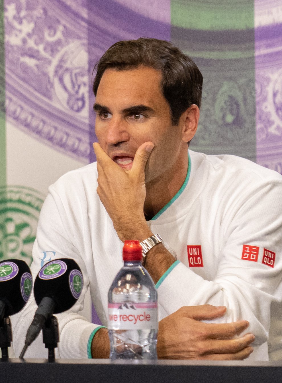<p>Roger Federer attends a press conference at Wimbledon</p>