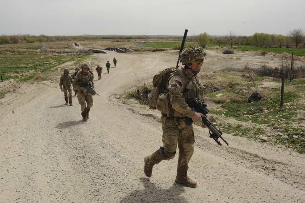 Soldiers while on patrol in the Deh Adam Khan district of Helmand Province, Afghanistan