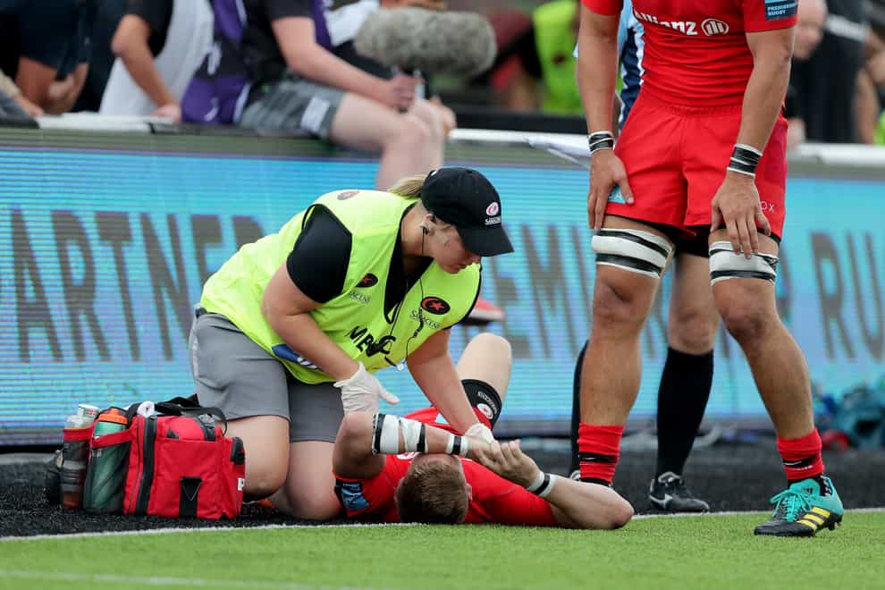 Saracens' David Strettle is treated for a head injury