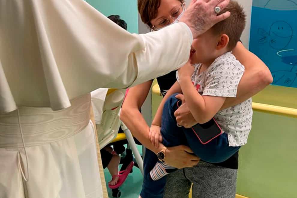 The Pope blesses a child