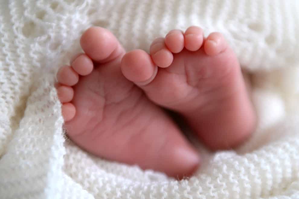 A new born baby’s feet (Andrew Matthews/PA)