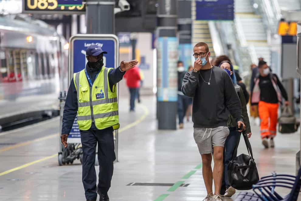 Passengers wearing face masks at Leeds railway station (Danny Lawson/PA)
