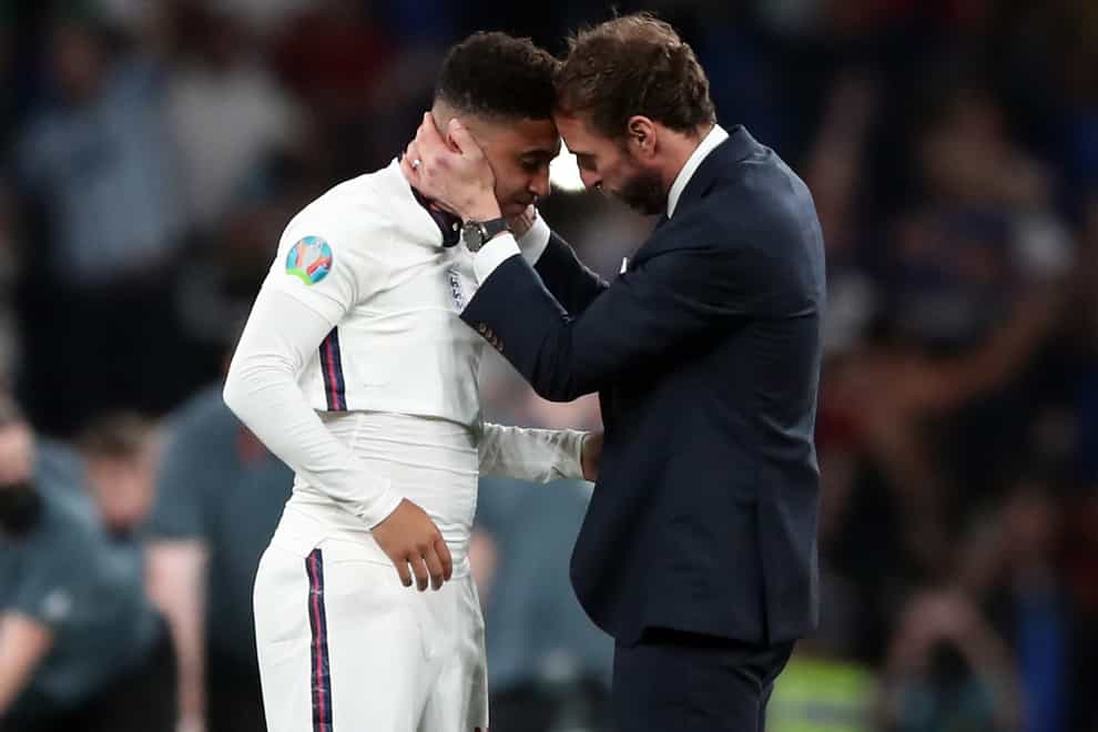England manager Gareth Southgate consoles Jadon Sancho after the penalty shoot-out