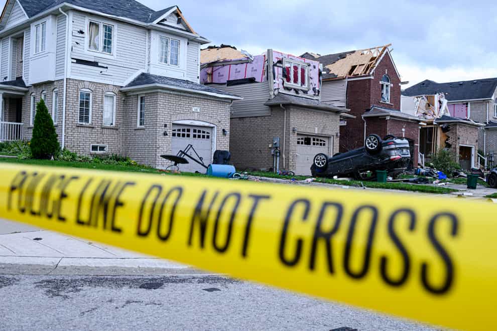Damage left after a tornado touched down in a neighbourhood of Barrie, Ontario, on Thursday (Christopher Katsarov/The Canadian Press via AP)