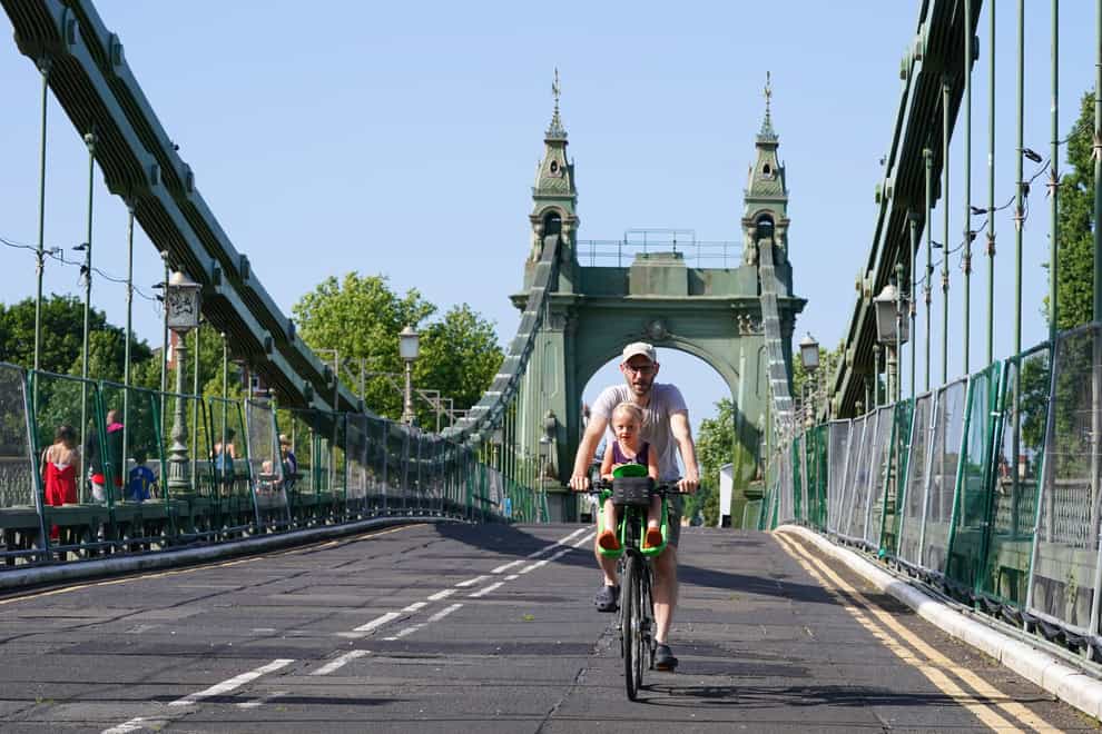 A cyclist on Hammersmith Bridge