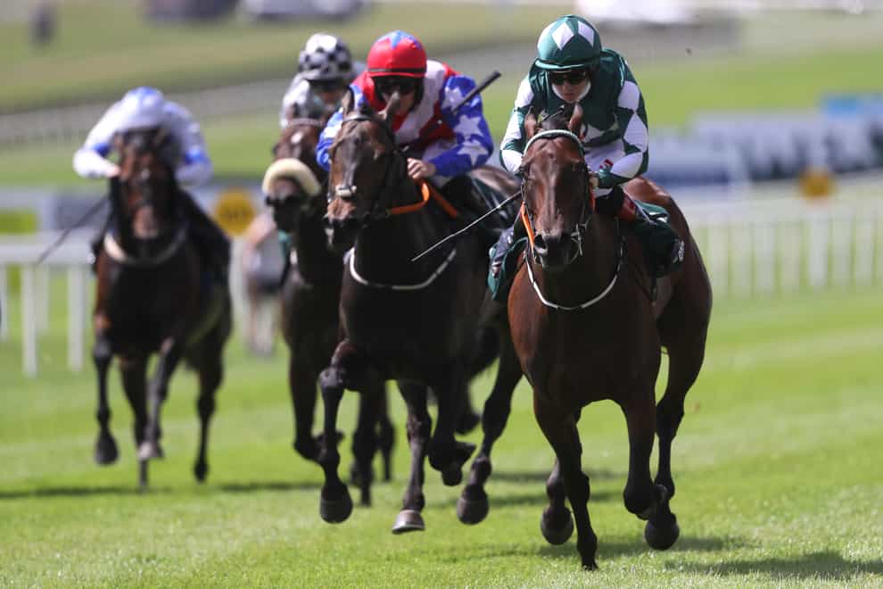 Mooneista (right) takes command to win the Paddy Power Sapphire Stakes at the Curragh