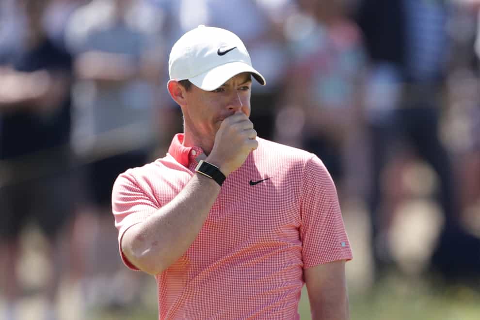 Rory McIlroy covers his mouth
