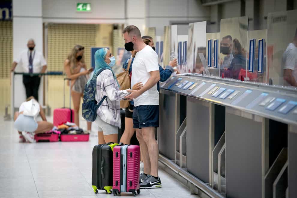 Holidaymakers check in at Glasgow Airport