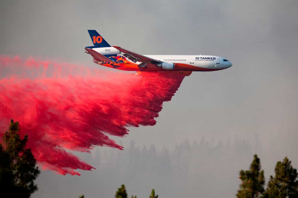 a DC-10 tanker drops retardant over the Bootleg Fire in southern Oregon