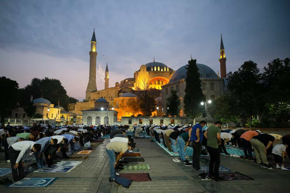 Muslims in Turkey offer prayers during the first day of Eid al-Adha, outside the Haghia Sophia in the historic Sultan Ahmed district of Istanbul (Mucahid Yapici/AP)