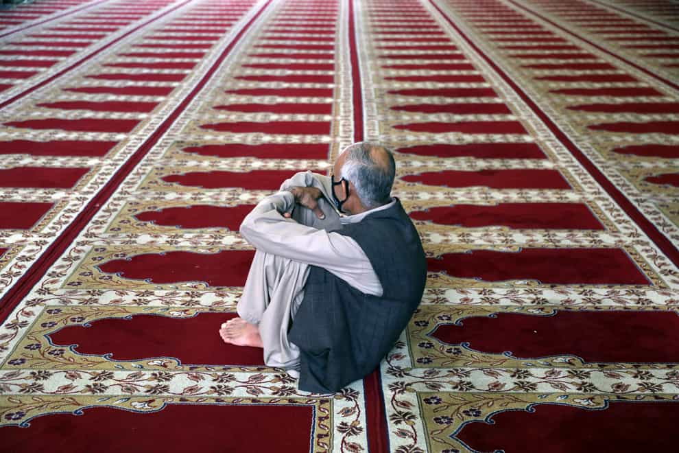 A Muslim worshipper offers Eid al-Adha prayers in Kabul, Afghanistan (Rahmat Gul/AP)