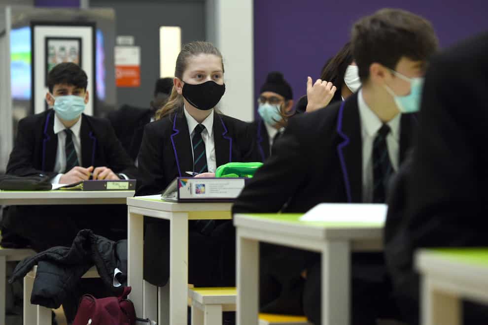 Children wearing facemasks during a lesson