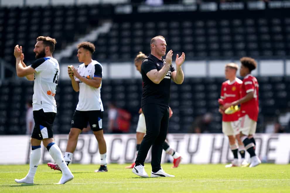 Derby manager Wayne Rooney applauds the fans