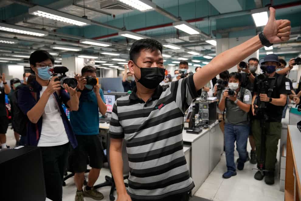 Lam Man-chung gives a thumbs-up gesture in the offices of the Apple Daily last month when the paper was forced to close