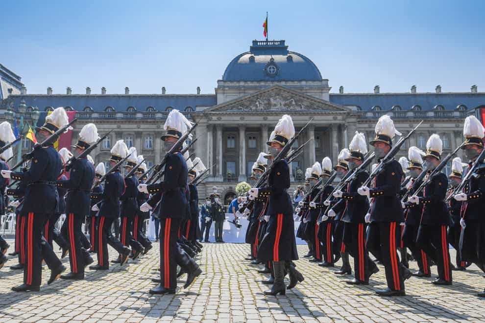 Belgium’s Crown Princess Elisabeth marches with cadets of the military school as they march by the royal tribune during the National Day parade in Brussels (Laurie Dieffembacq/AP)