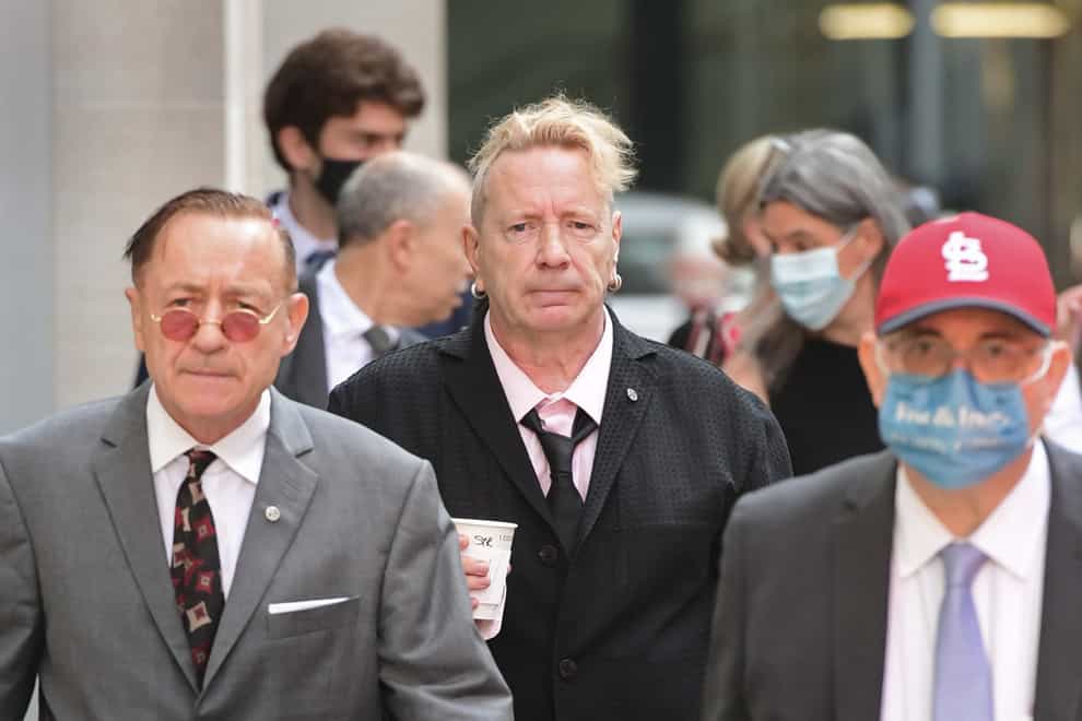 John Lydon, aka Johnny Rotten, centre, arrives at court (Ian West/PA)
