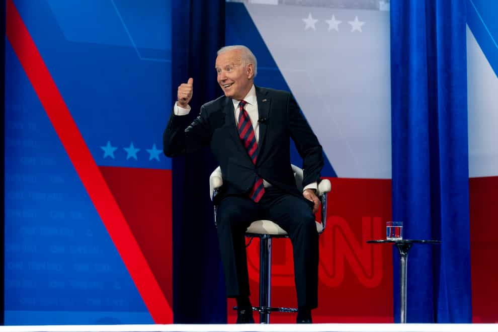 President Joe Biden interacts with members of the audience during a commercial break for a CNN town hall at Mount St Joseph University in Cincinnati (Andrew Harnik/AP)