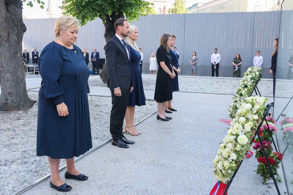 Norway’s Prime Minister Erna Solberg, Crown Prince Haakon Magnus, Crown Princess Mette-Marit, AUF leader Astrid Hoem and leader of the National Support Group Lisbeth Kristine Royneland attend a memorial service marking the 10-year anniversary of the terrorist attack by Anders Breivik, in the Government Quarter, Oslo (Geir Olsen/NTB scanpix via AP)