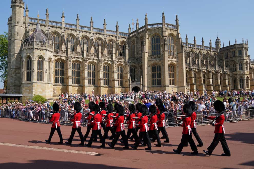 Members of the 1st Battalion Grenadier Guards arrive for the Changing of the Guard at Windsor Castle in Berkshire (Andrew Matthews/PA)