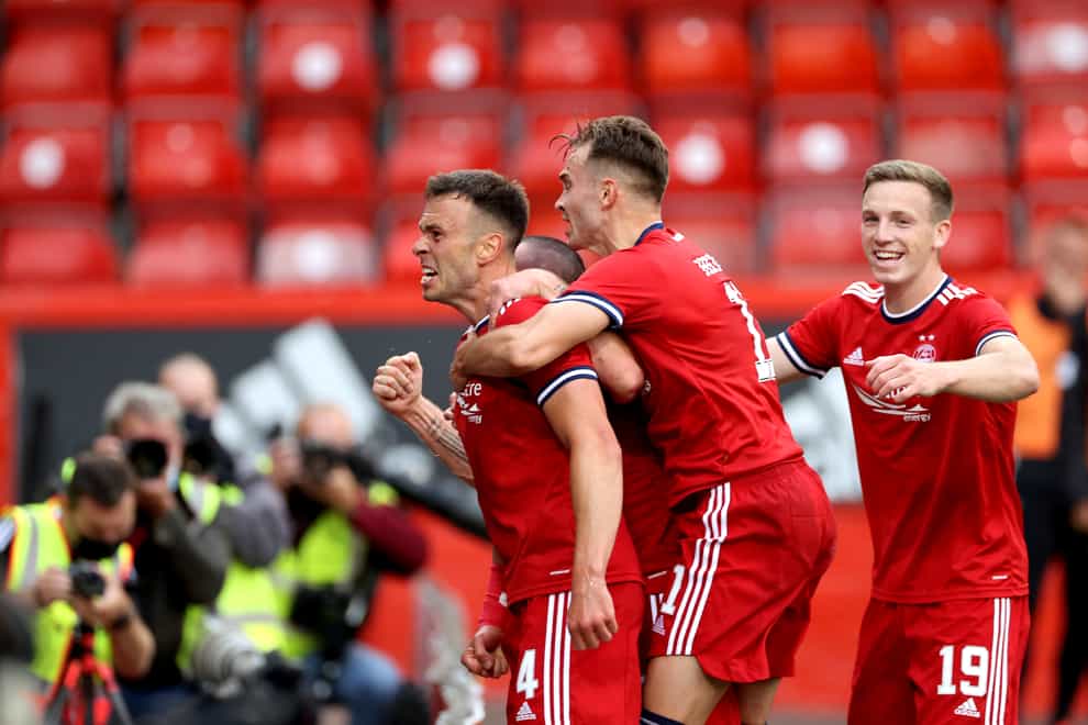 Andy Considine celebrates his opener in front of the Aberdeen fans (Steve Welsh/PA)
