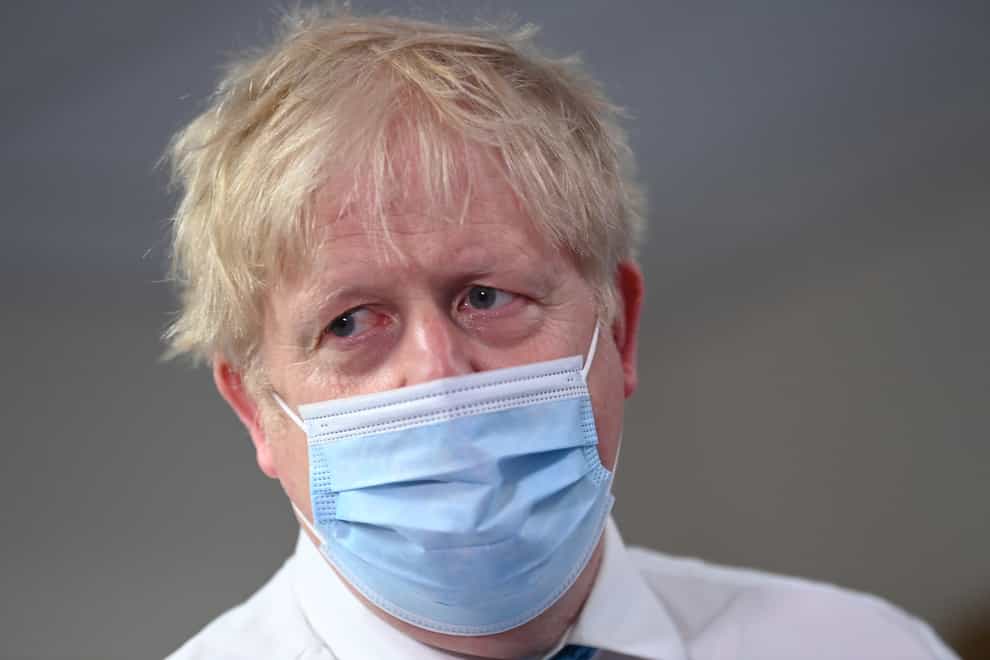 Prime Minister Boris Johnson during a visit to Colchester Hospital in Essex in May 2021 (PA)