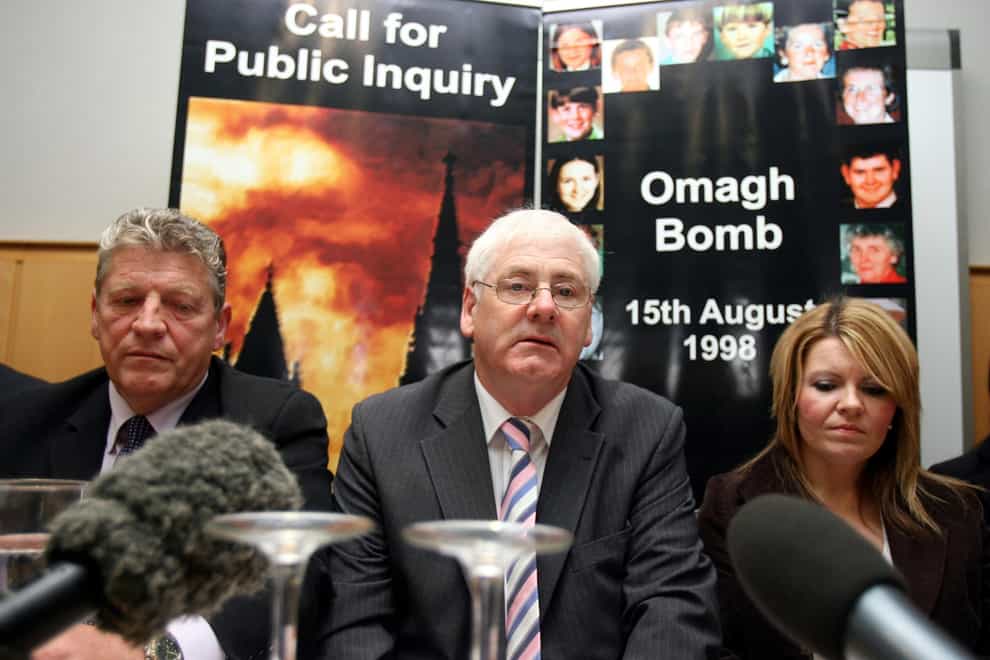 Michael Gallagher, centre, and other relatives of victims of the Omagh terrorist attack have continued to fight for justice (PA)