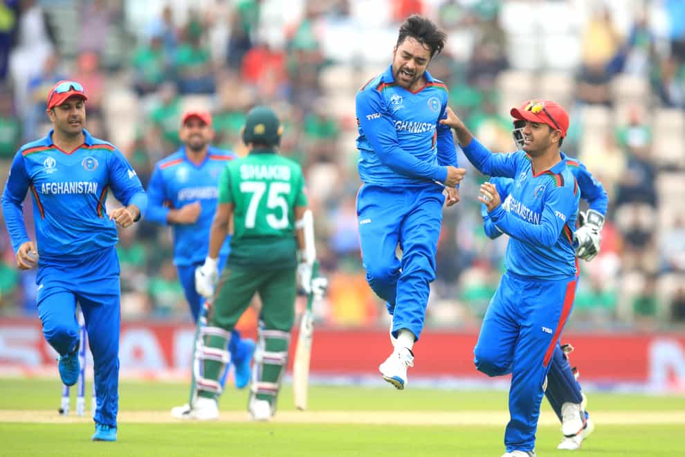 Rashid Khan celebrates taking a wicket for Afghanistan (Adam Davy/PA)