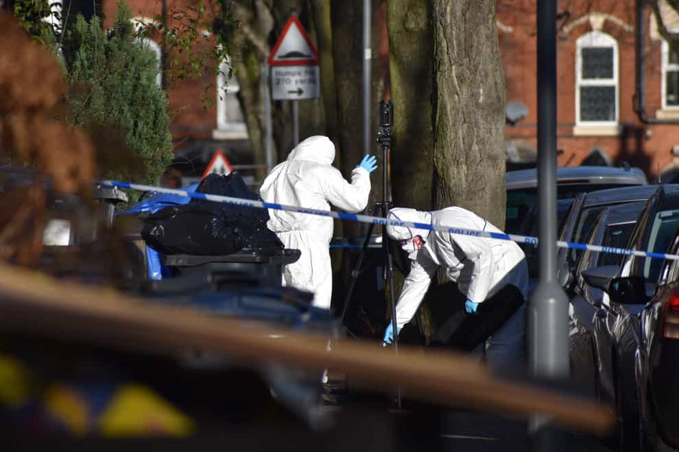 Police at the scene in Linwood Road, Handsworth, where a 15-year-old boy died (PA)