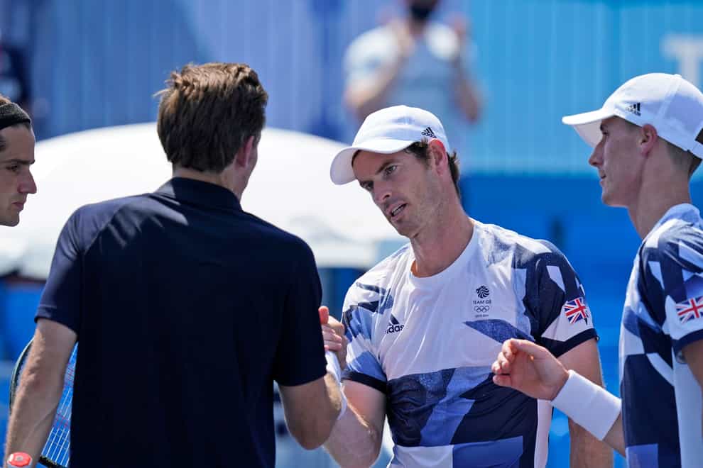 Andy Murray (second right) and Joe Salisbury bump fists with Nicolas Mahut and Pierre-Hugues Herbert (Seth Wenig/AP)