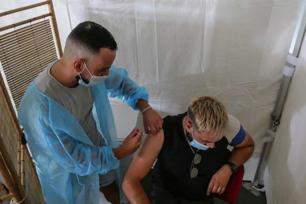 A man receives a Pfizer Covid-19 vaccine in the south of France (AP)