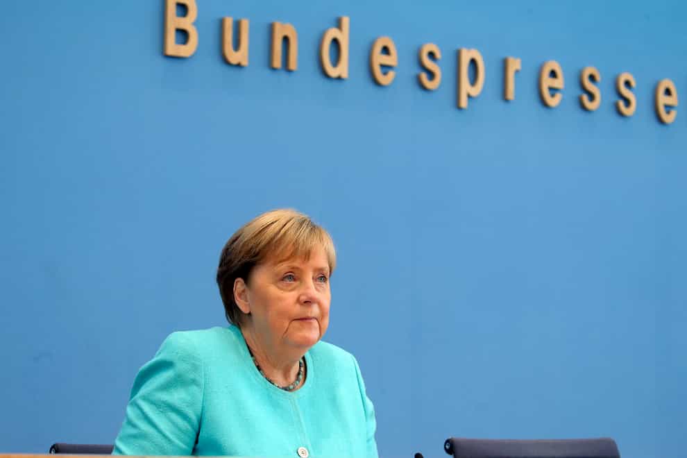 German Chancellor Angela Merkel holds her annual summer news conference in Berlin (Wolfgang Kumm/dpa/AP)