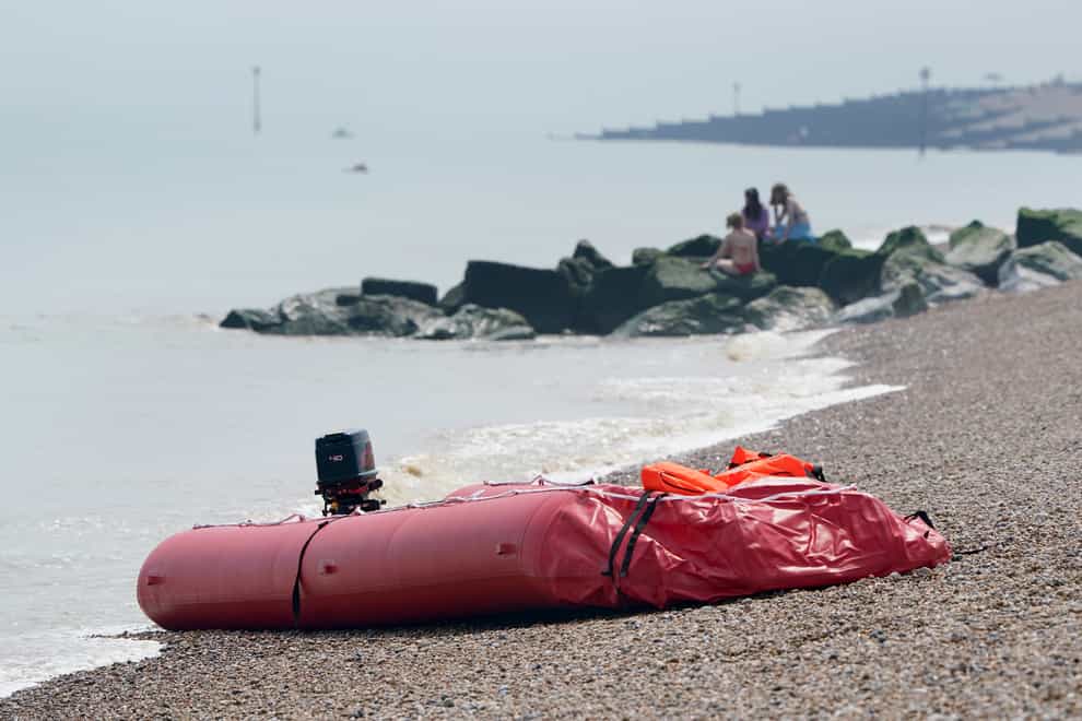 A boat thought to be used in a migrant crossing is left on the beach in Walmer, Kent (Gareth Fuller/PA)