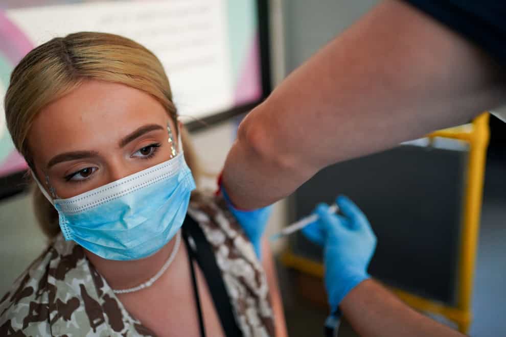 Festival goer Ellie Harries receives her 2nd Pfizer vaccine dose at a Covid-19 vaccination bus at Latitude festival in Henham Park, Southwold, Suffolk. Picture date: Sunday July 25, 2021.