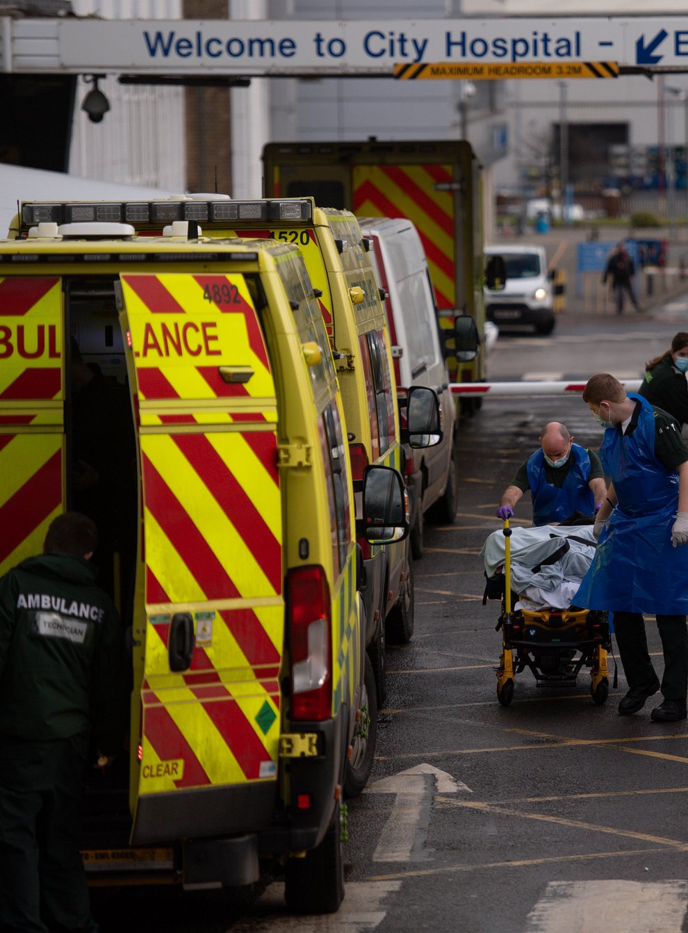 Ambulance crews transport patients into City Hospital in Birmingham at the height of the second wave of coronavirus in January 2021 (Jacob King/PA)