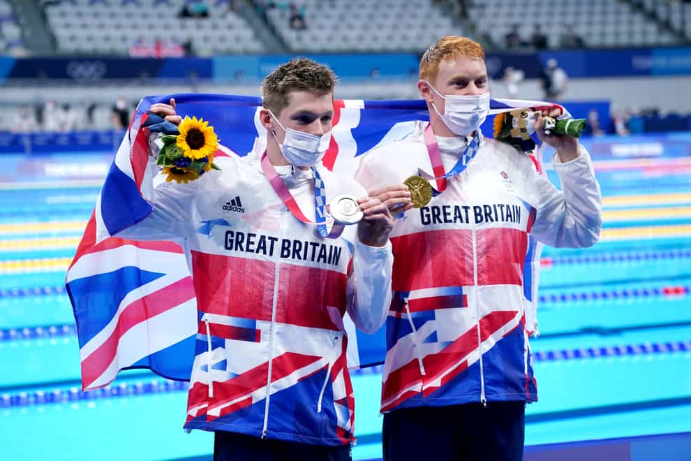 Tom Dean, right, and Duncan Scott, left, with their medals (Adam Davy/PA)
