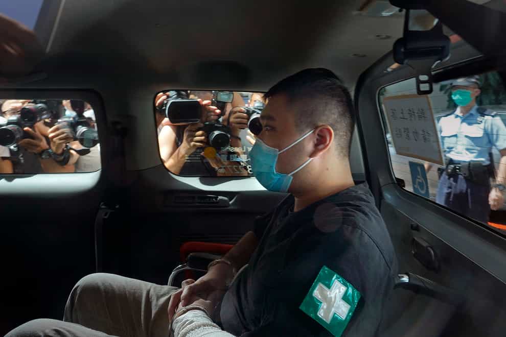 Tong Ying-kit arrives at Hong Kong High Court in a police van (Vincent Yu/AP)