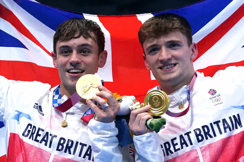 Great Britain’s Tom Daley (left) and Matty Lee celebrate winning gold in the Men’s Synchronised 10m Platform Final at the Tokyo Aquatics Centre on the third day of the Tokyo 2020 Olympic Games in Japan. Picture date: Monday July 26, 2021.